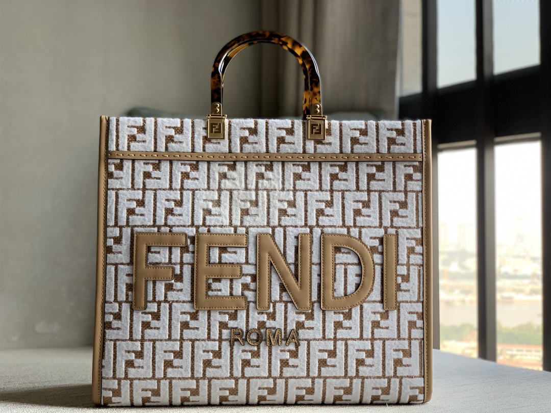 Fendi Sunshine medium genuine tote bag in original raffia woven with brocade-effect chenille FF pattern embroidery for a unique feel. Decorated w