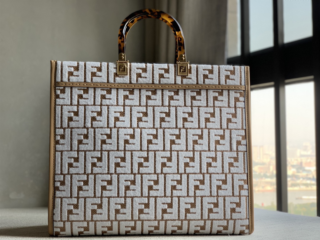 Fendi Sunshine medium genuine tote bag in original raffia woven with brocade-effect chenille FF pattern embroidery for a unique feel. Decorated w