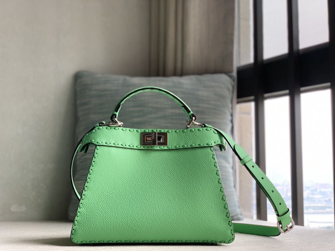 Fendi's iconic Peekaboo ISeeU small handbag, made of pure raw calfskin and green Cuoio Romano leather, decorated with hand-stitching of the same