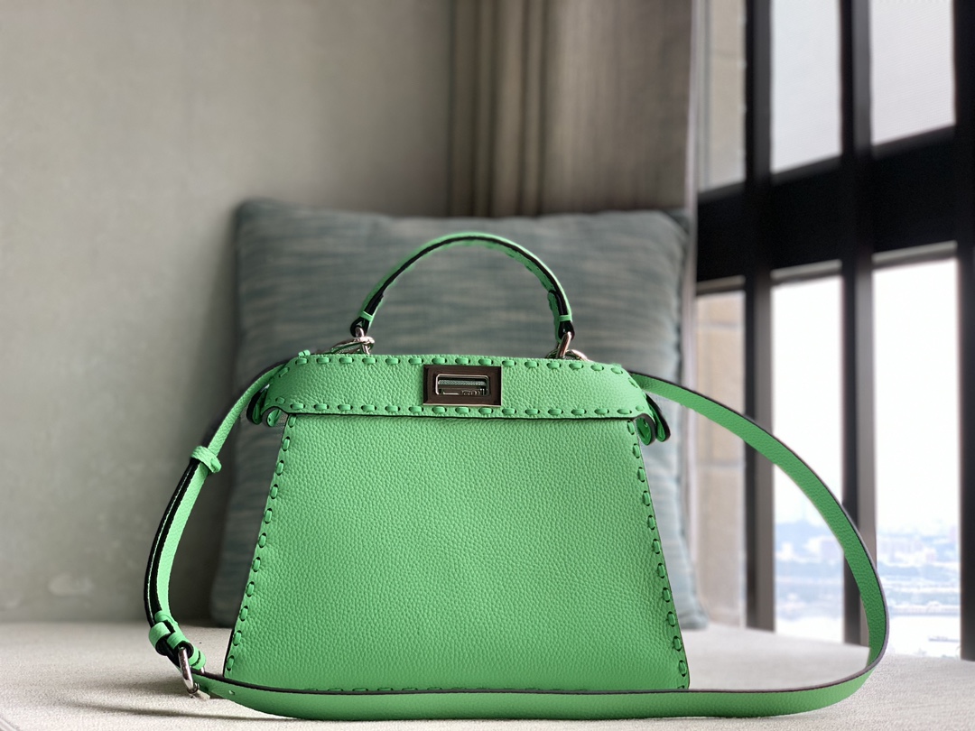 Fendi's iconic Peekaboo ISeeU small handbag, made of pure raw calfskin and green Cuoio Romano leather, decorated with hand-stitching of the same