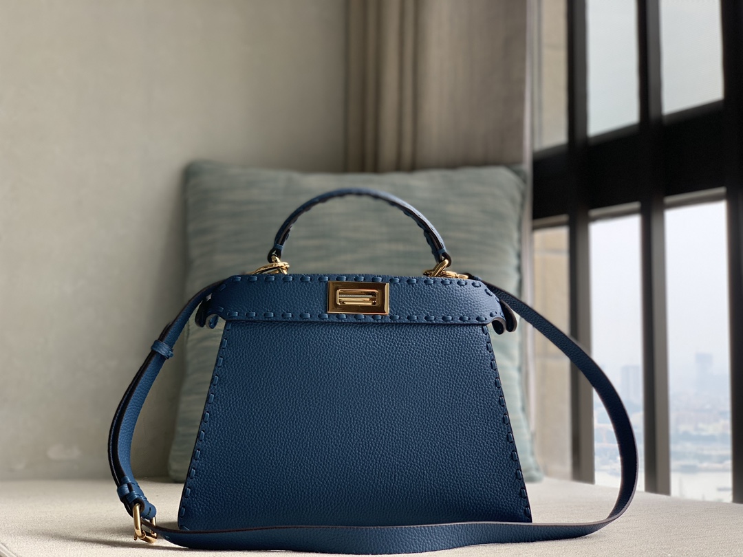 Fendi's iconic Peekaboo ISeeU small handbag in pure raw calfskin, made of blue Cuoio Romano leather, decorated with hand-stitching of the same co