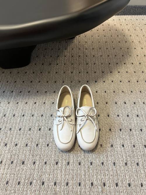 Miu Miu Women's Leather Loafers, Elegant Slip-Ons with Bow Detail, Sizes 35-40 1 Miu Miu Women's Leather Loafers, Elegant Slip-Ons with Bow Detail, Sizes 35-40