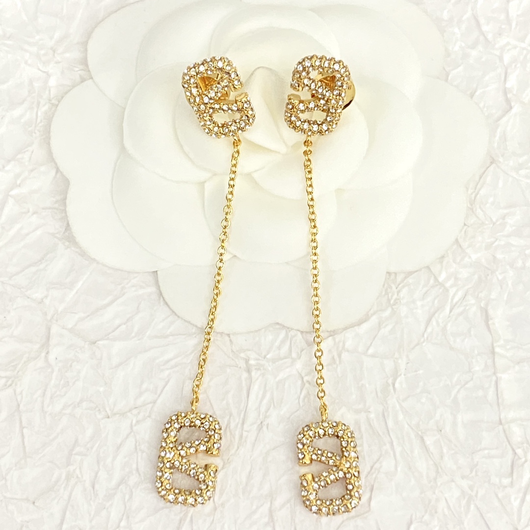 Valentino’s Stunning Gold Earrings: Graceful Fashion Statement with Endless Appeal.