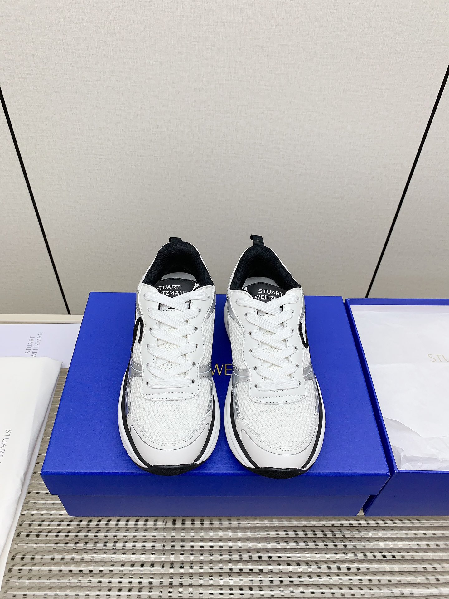 Stuart Weitzman Steinman SW Trainer Belt Sneakers: Fashion meets function with comfort and style.