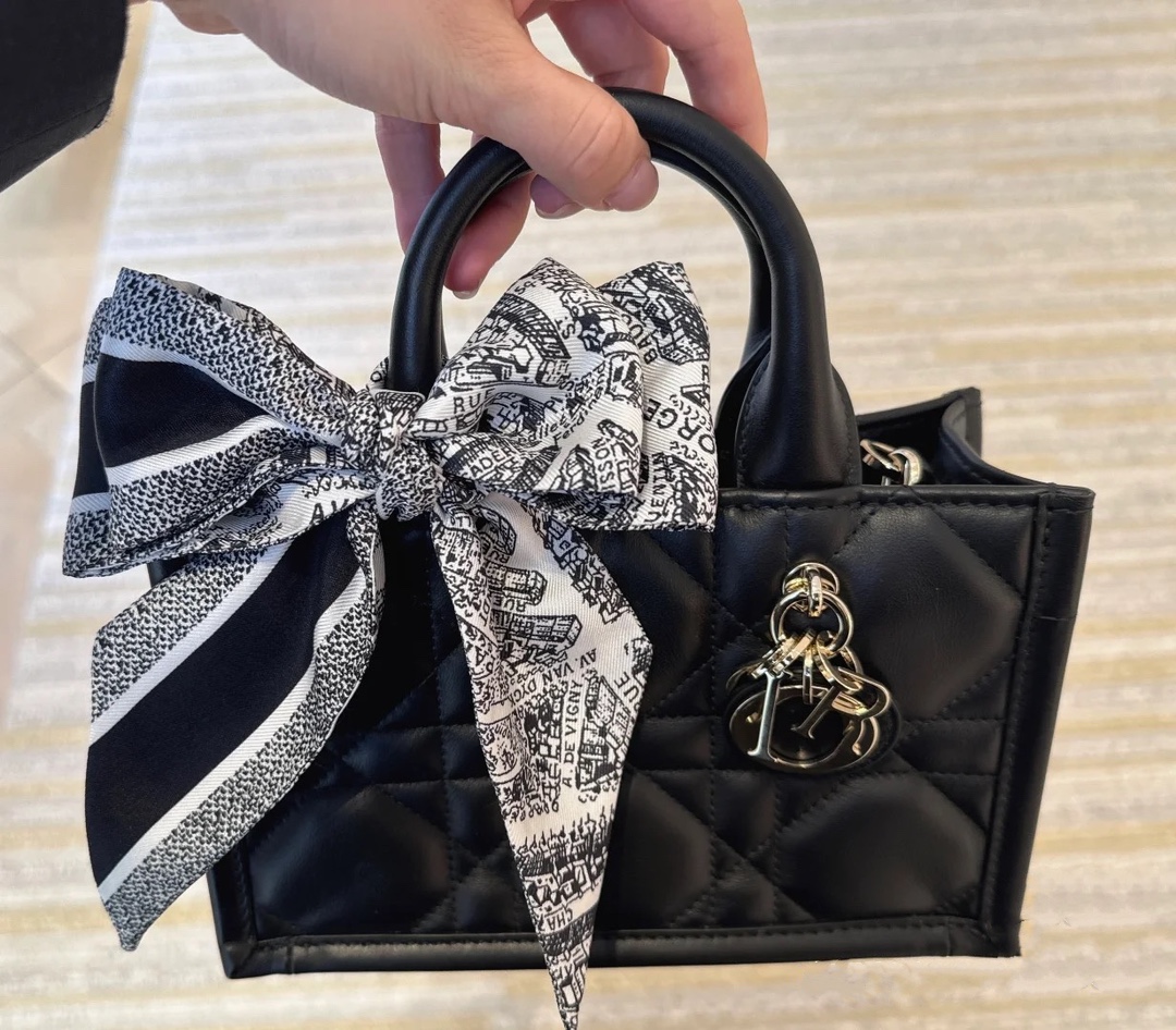 Hand-heldcrossbody, DIY the handle and wear it with a silk scarf to look more youthful and energetic Dior book tote