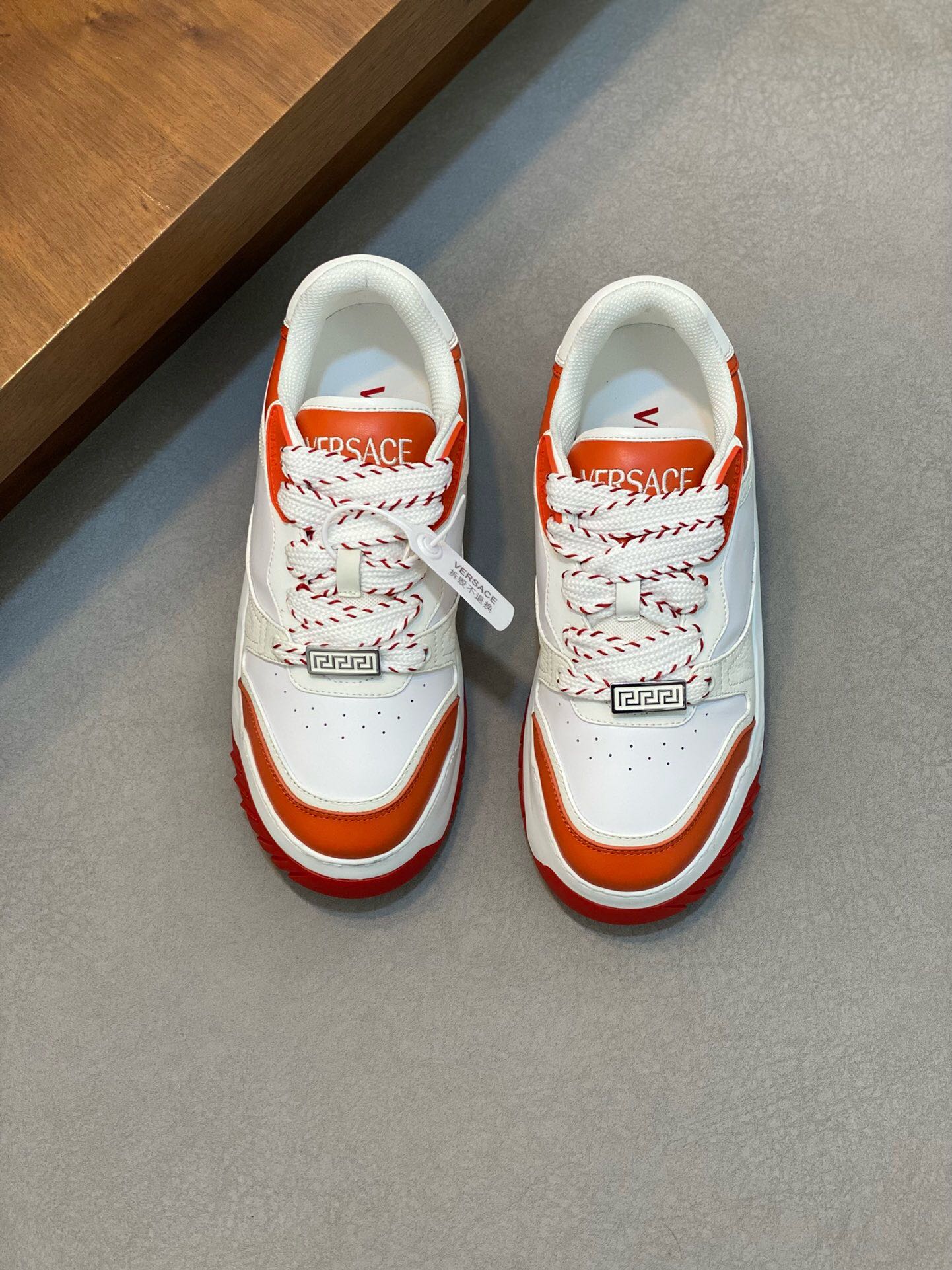 NO:218719,Brand VERSACE color original color matching code number 39-44 customized 38.45.46 price Material Versace new men's casual shoes!  A must-have for trendy men!  Eclectic details create a unique shoe that features a lightweight, buckled rubber sole inspired by the iconic Versace chain jewelry. The iconic elements on the latest Versace sneakers include the iconic Greek key pattern, the 