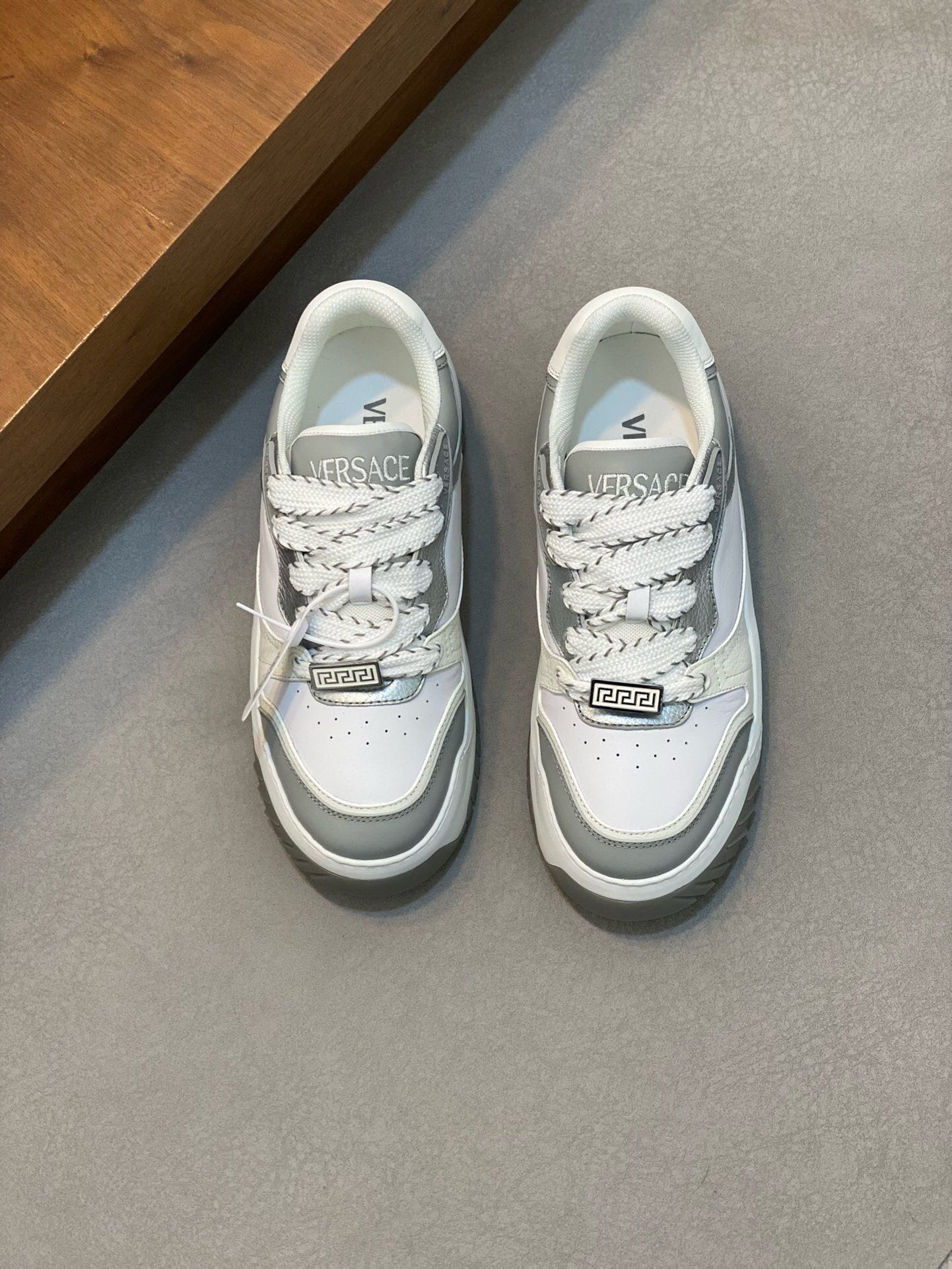 NO:218728,Brand VERSACE color original color matching code number 39-44 customized 38.45.46 price Material Versace new men's casual shoes!  A must-have for trendy men!  Eclectic details create a unique shoe that features a lightweight, buckled rubber sole inspired by the iconic Versace chain jewelry. The iconic elements on the latest Versace sneakers include the iconic Greek key pattern, the 