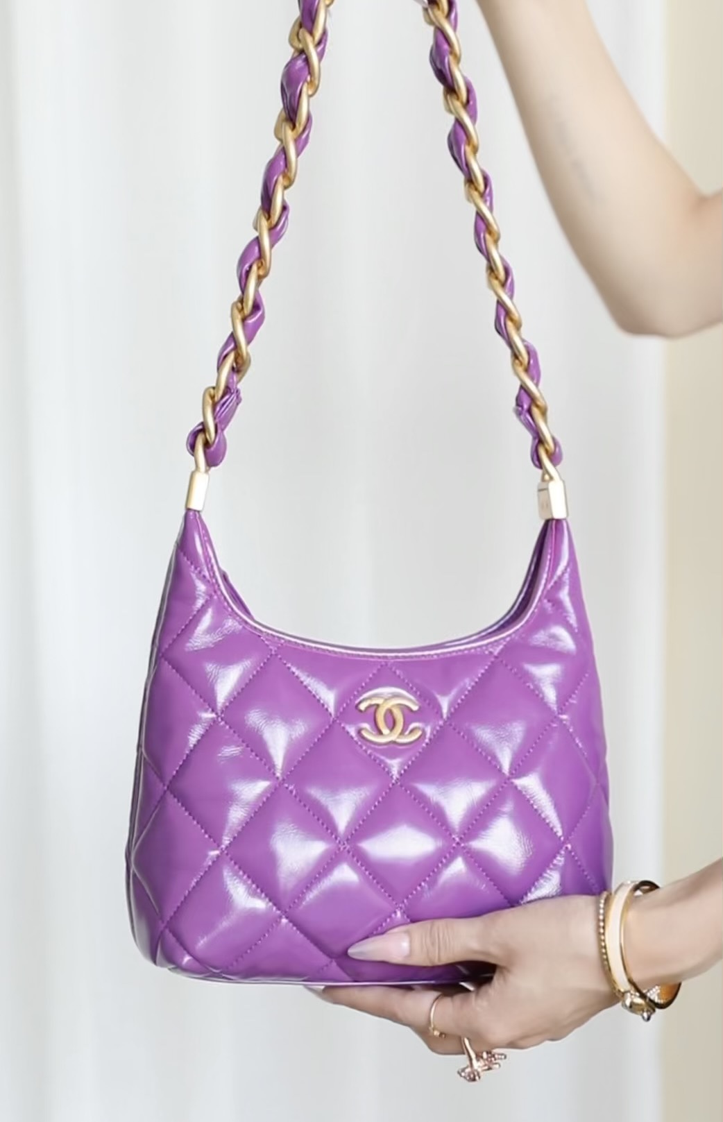 The romantic purple and gold palette of the hobo underarm bag - Bag