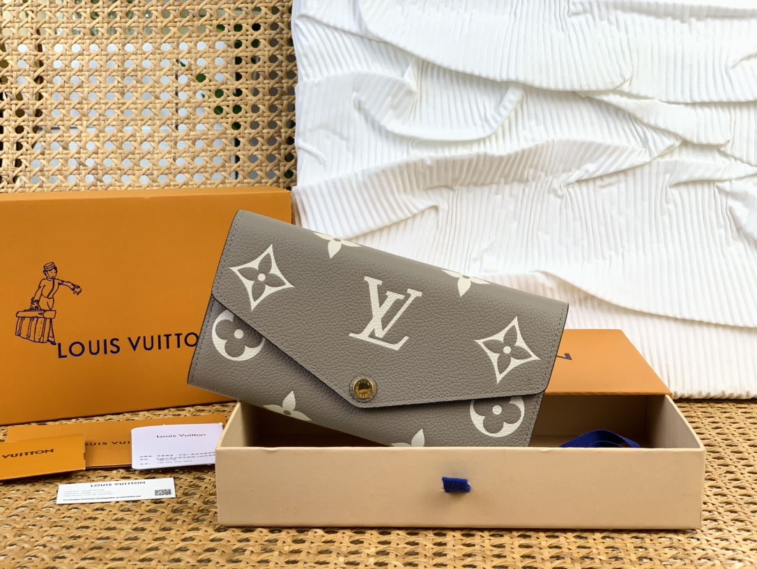 Louis Vuitton Geldbörse Gold Grau Gravur M81049