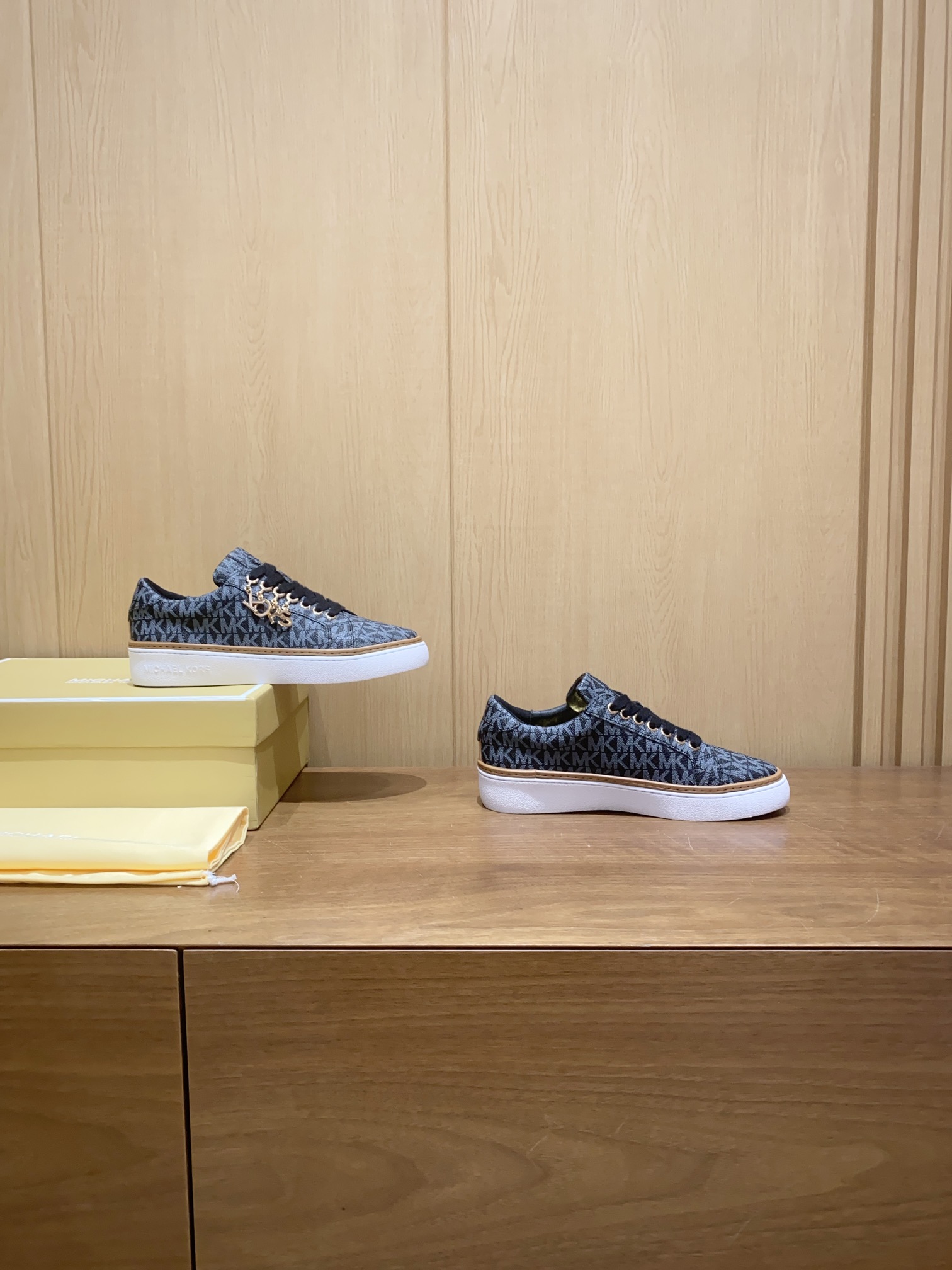 Product Summary: Michael Kors Recreational Shoes with Black Stamp, Sheepskin Interior, and Slide-Proof Rubber Sole.