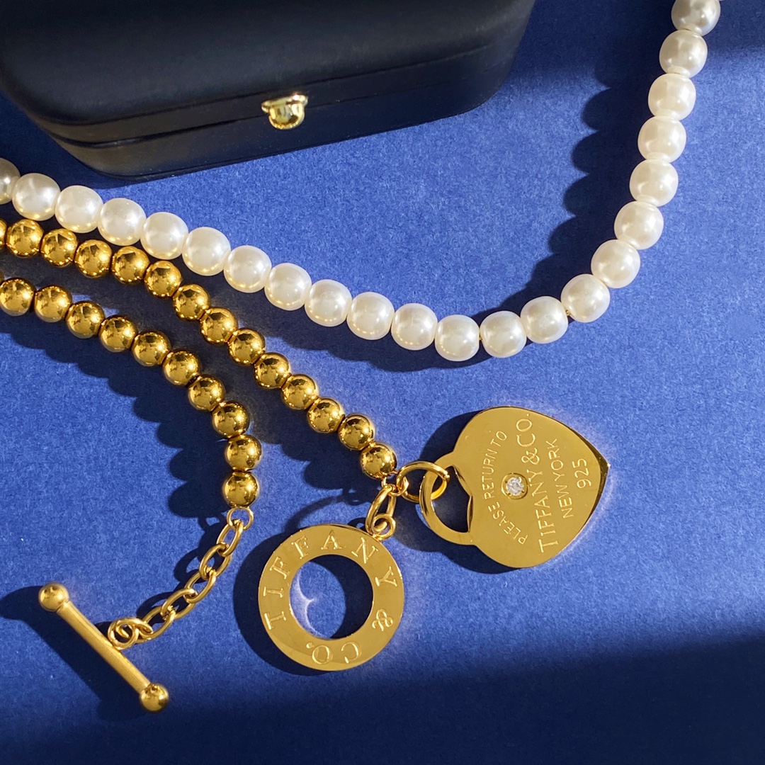 Tiffany Co Return to Tiffany Heart Tag necklace gold-tone metal white pearl clear diamond accent 18 inches