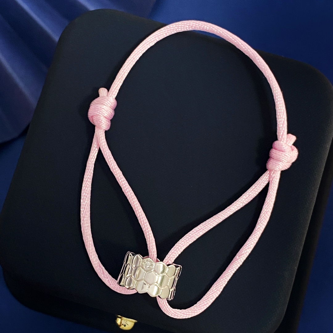 Luxury Jewelry Collection Featuring Silver, Gold, Brass, and Hand-Woven Red Rope