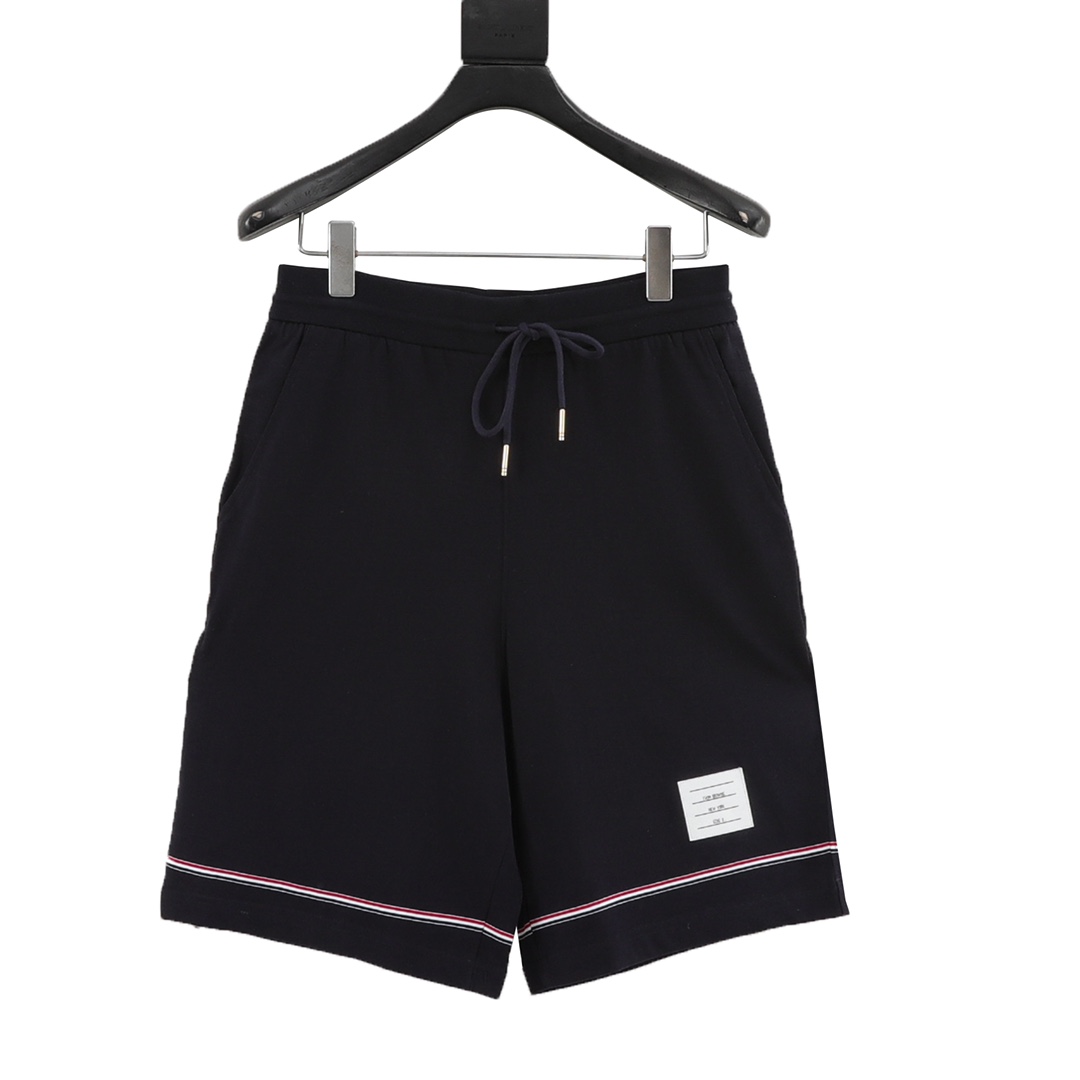 Thom Browne/Thomas Brown: pantalones cortos con cinta tricolor. Tejido personalizado y teñido, con punto de canalé cruz…