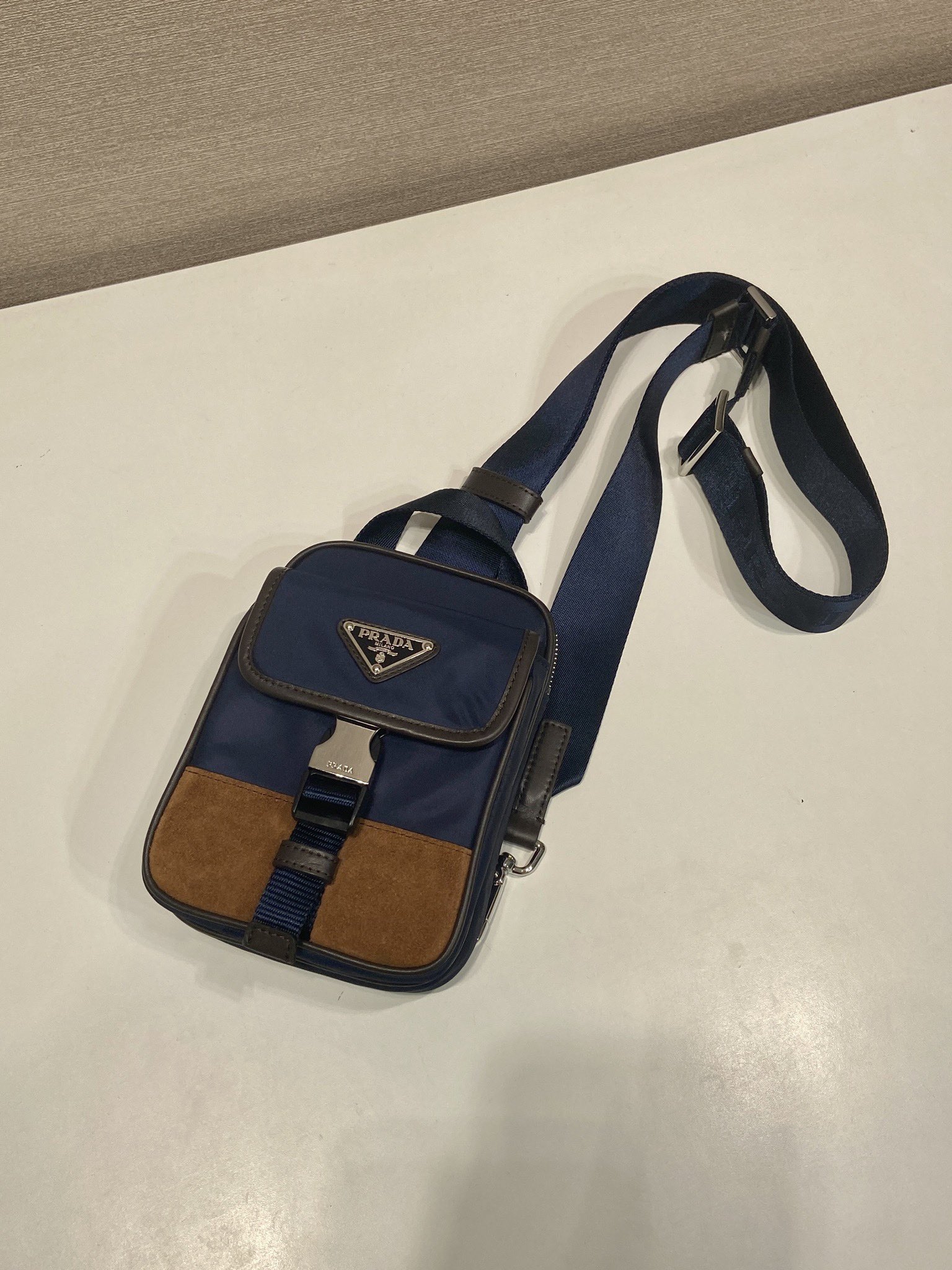Stylish Black Nylon & Saffiano Leather Phone Pouch with Triangle Logo 5 i1745742325 2036 3
