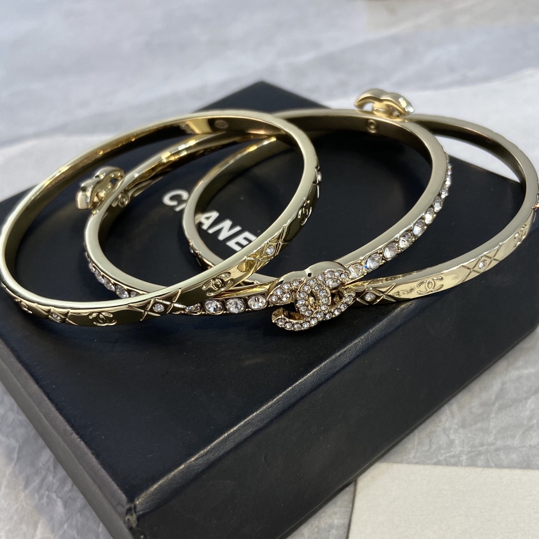Chanel CC Logo Quilted Crystal Stacked Bangle bracelet gold-tone metal with clear crystal accents 17cm inner circumference