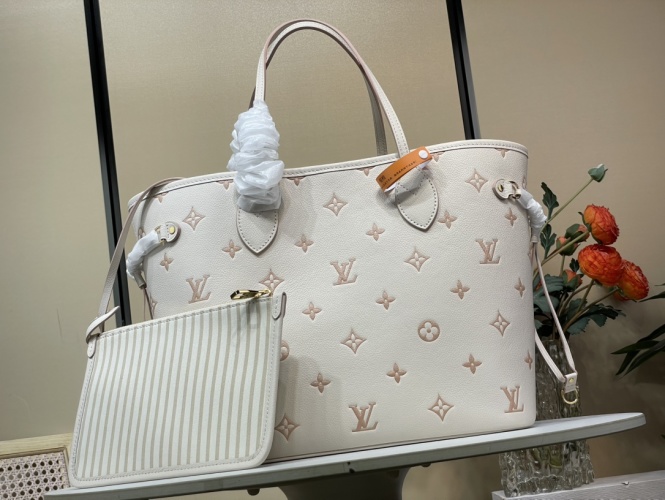 Louis Vuitton Neverfull MM Cream Monogram Empreinte Leather Tote Bag 1 Louis Vuitton Neverfull MM Cream Monogram Empreinte Leather Tote Bag