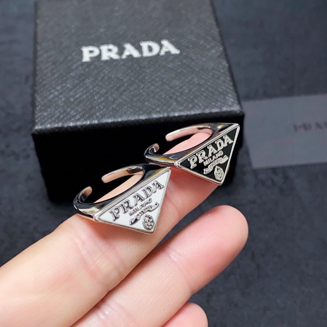 Prada Triangle Logo Open Ring. Silver-tone finish. Adjustable fit, chic style.