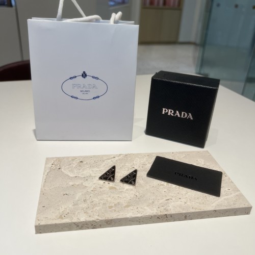 Prada Triangle Logo Earrings - Stylish Studs for Women and Men 1 Prada Triangle Logo Earrings – Stylish Studs for Women and Men