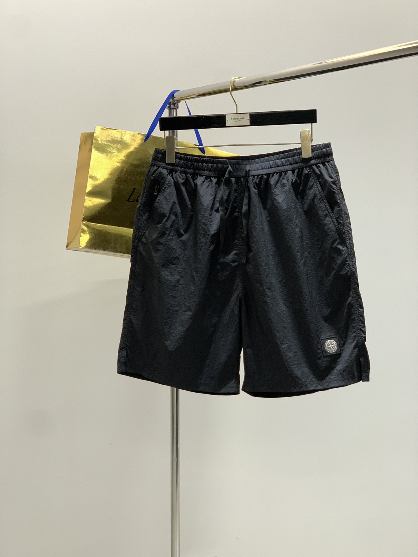 Stone Island Sand Shorts: Classic Style, Polyester Fabric, Customized Sizes Available.
