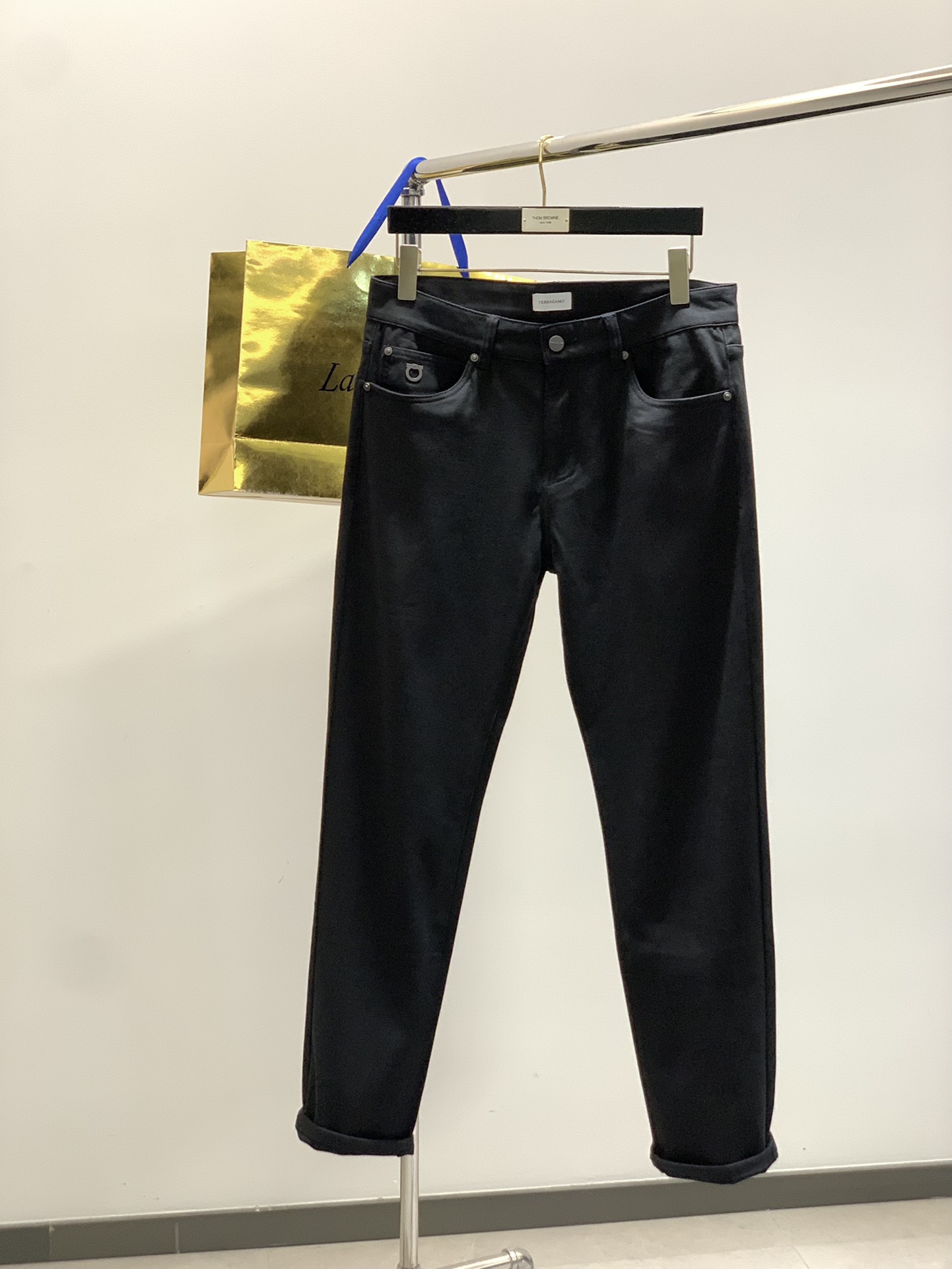 “Ferragamo Filagmu Spring 2025: Luxury Jeans with Custom Water-Washed Design”