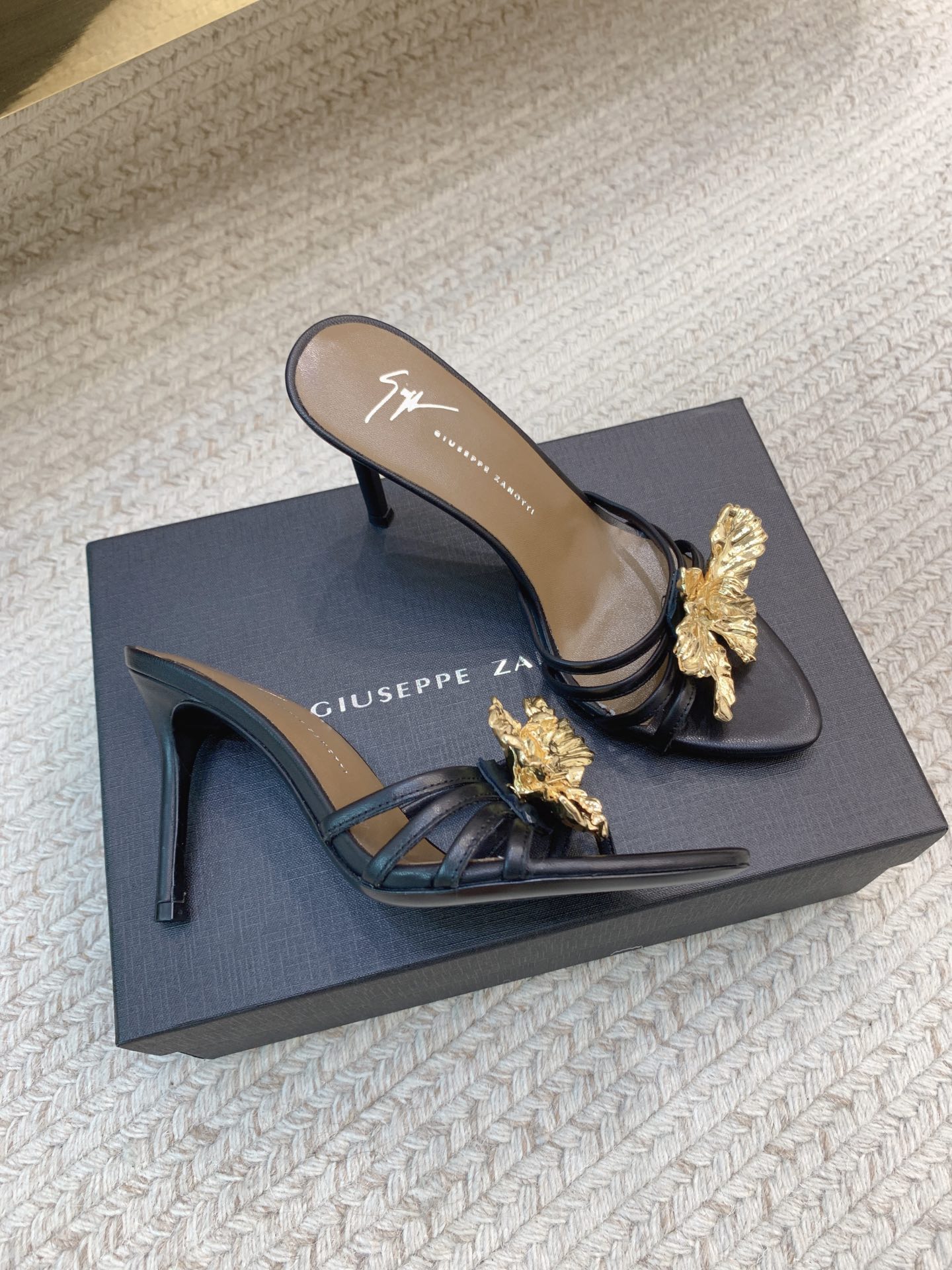 High-quality Giuseppe Zanotti Slippers with Big Buttons: SS25 Collection Overview