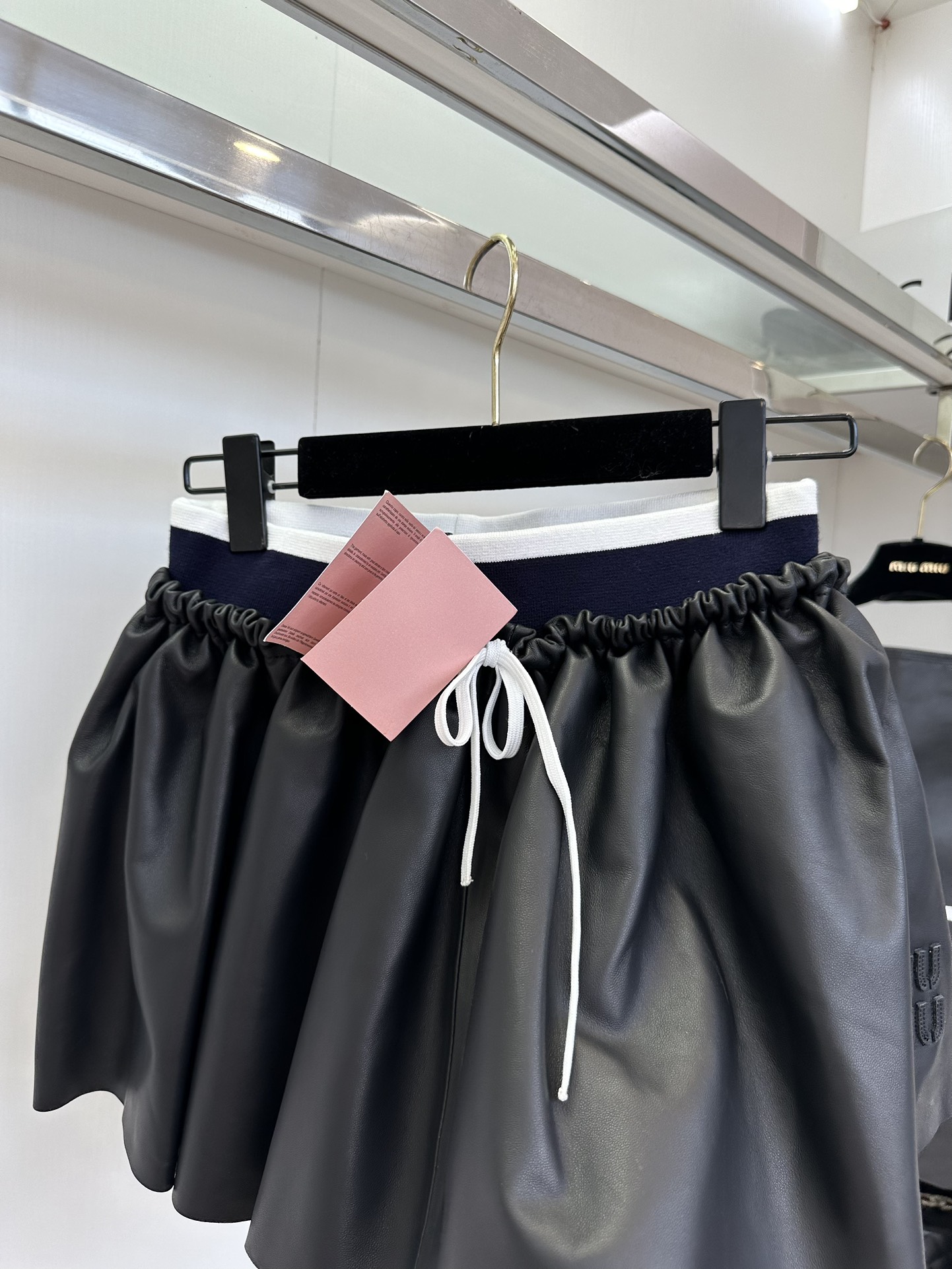 Miu Miu Nappa Leather Pleated Mini Skirt: Timeless Style & Flattering Fit 5 i1753606795 7069 3