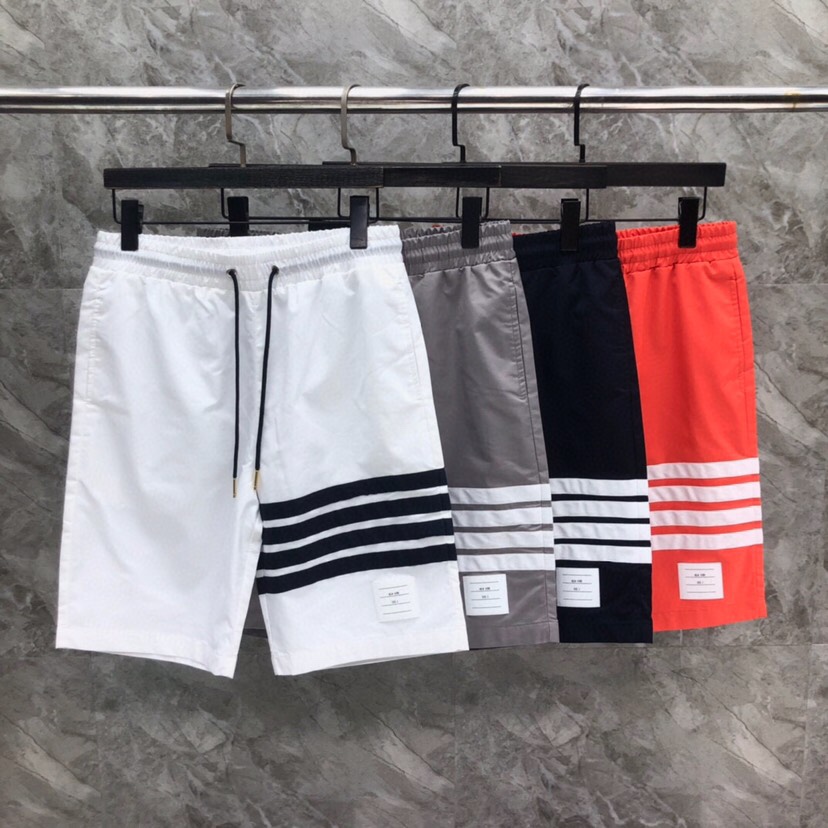 “THOM BROWNE Classic Four-Bared Sandal Shorts in Gray, Tibetan Cyan, White, and Orange” - 图片 9