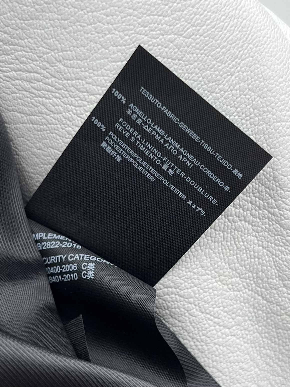 “Women’s Sheep Hide Coat: Miss Dior Style with Asymmetrical Zippers and Dustproof Bag” - 图片 9