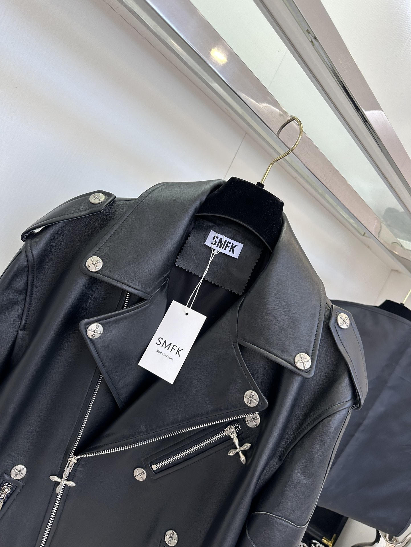 Women's Black Leather Motorcycle Jacket with White Cross Detail 6 i1757412122 7911 4