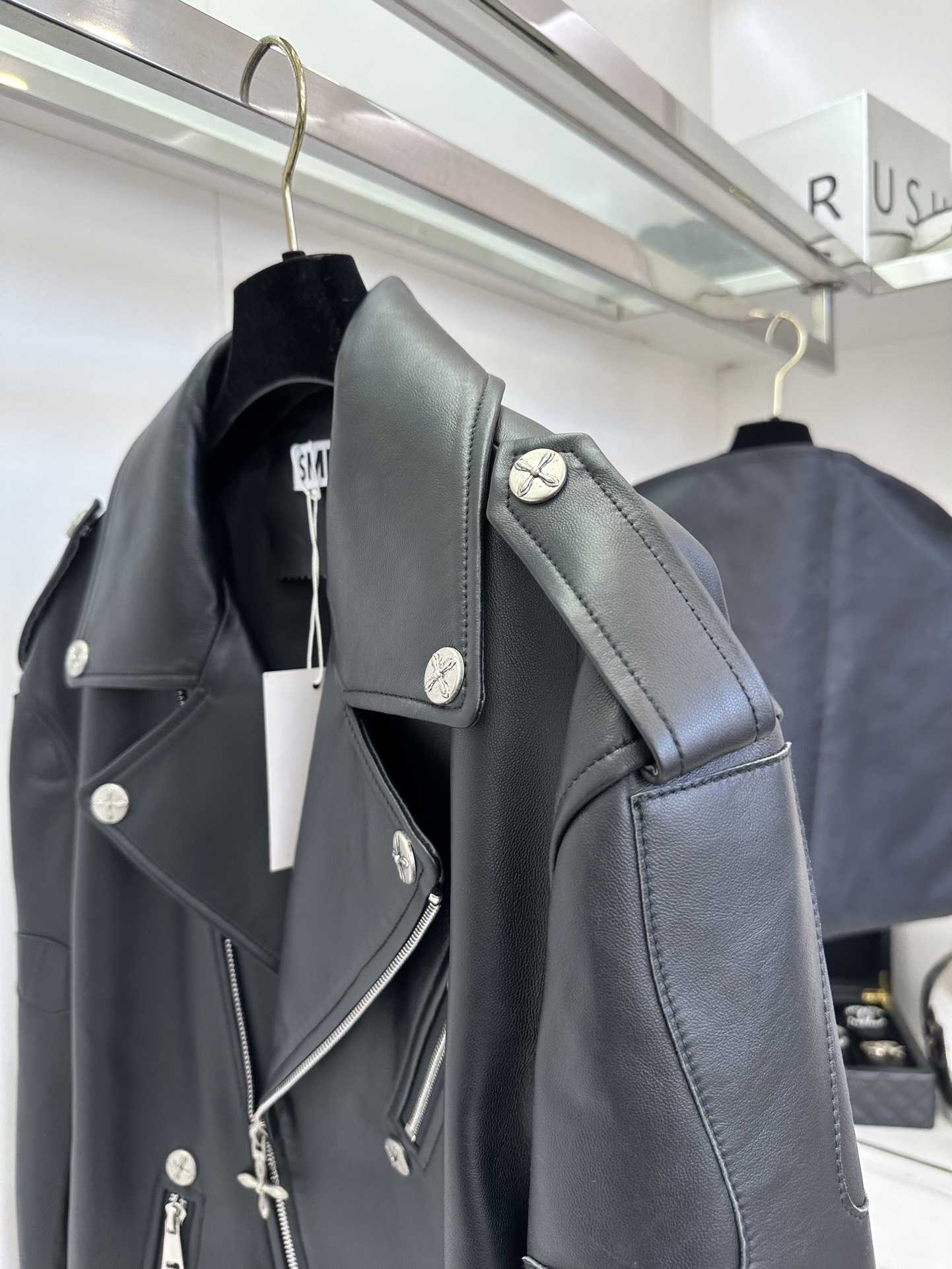 Women's Black Leather Motorcycle Jacket with White Cross Detail 5 i1757412122 963 3