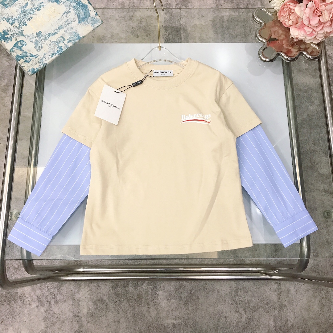 NO:579135,[Ready stock] size- Balenciag* fake two-piece long-sleeved bottoming shirt. Customized plaid sleeve splicing design. Excellent color rendering. Classic wavy logo printing. Both front and back. Small logo on the chest and large logo on the back. Pure cotton. Slightly elastic, soft and comfortable ~ high-density pure cotton. Silky, delicate and shiny high-end fashion style. Made of imported high-end customized selected high-quality organic cotton fabrics. Comfortable and breathable. The upper body effect is very good. Color apricot gray  Size-110-120-130-140-150-[CM] Need counter packaging, clothes, balenciaga,19860909【现货发】  size- Balenciag* 假两件长袖打底衫 定制格子纹袖子拼接设计 显色度超级赞 经典波浪纹logo印花 前后两面均有 胸前小logo胸后大面积logo 纯棉 微弹柔软舒适～高密度纯棉 丝滑细腻有光泽高级时髦款,采用进口高端定制精选优质有机棉面料 舒适透气 上身效果非常好 颜色杏色 灰色 尺码-110-120-130-140-150-【CM】 需要专柜包装元,衣服,balenciaga,,Children's