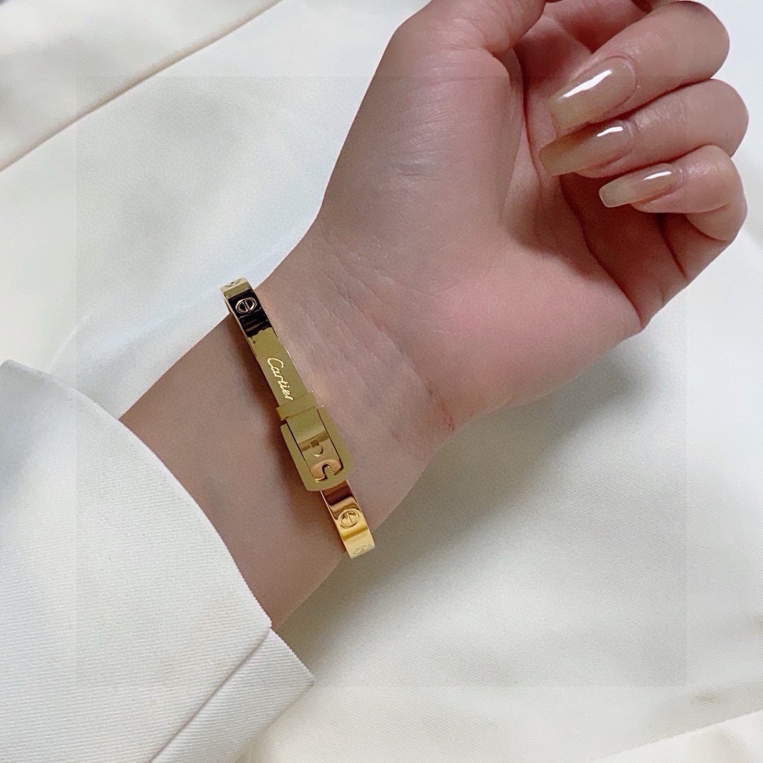 Cartier Buckle Motif Love Bangle bracelet Polished yellow gold-tone metal polished silver-tone metal no gemstones 17cm inner circumference
