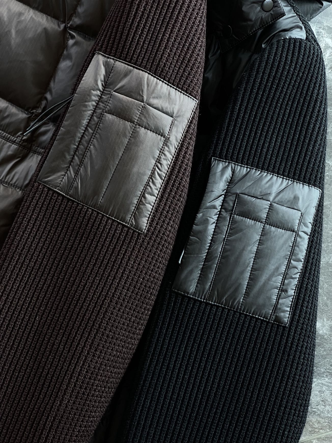 羽绒服 🆕 CP针织拼接羽绒服 当方形绗缝在100%锦纶面料上铺展开来，L码112克白鸭绒便在格子里安了