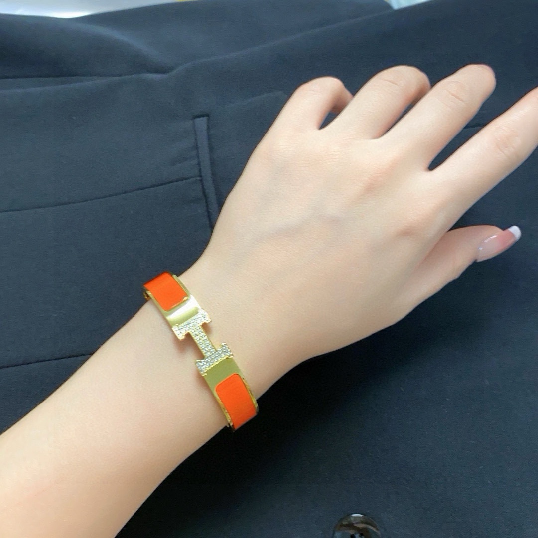 Hermes Clic H MM Diamond bracelet Yellow gold with white orange black enamel and diamond accents