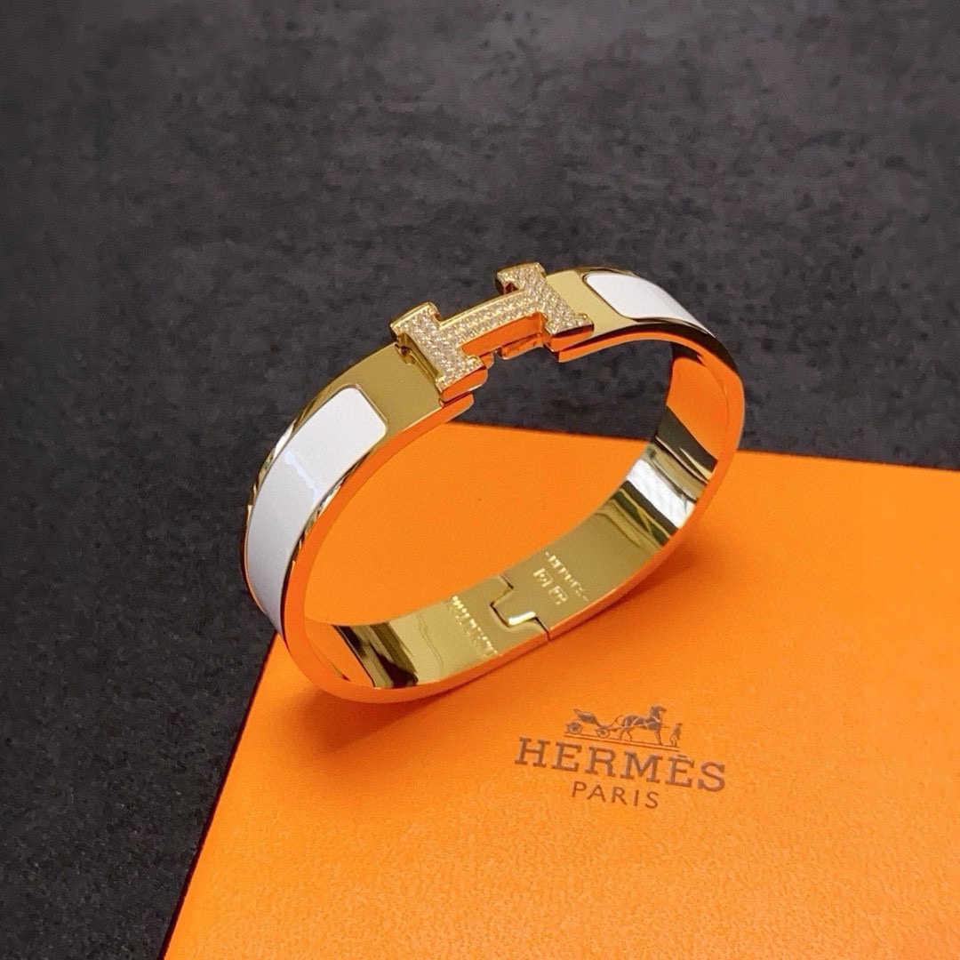 Hermes Clic H MM Diamond bracelet Yellow gold with white orange black enamel and diamond accents