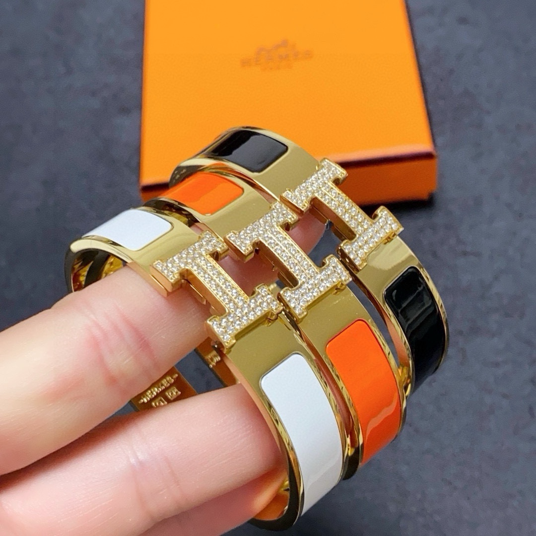 Hermes Clic H MM Diamond bracelet Yellow gold with white orange black enamel and diamond accents