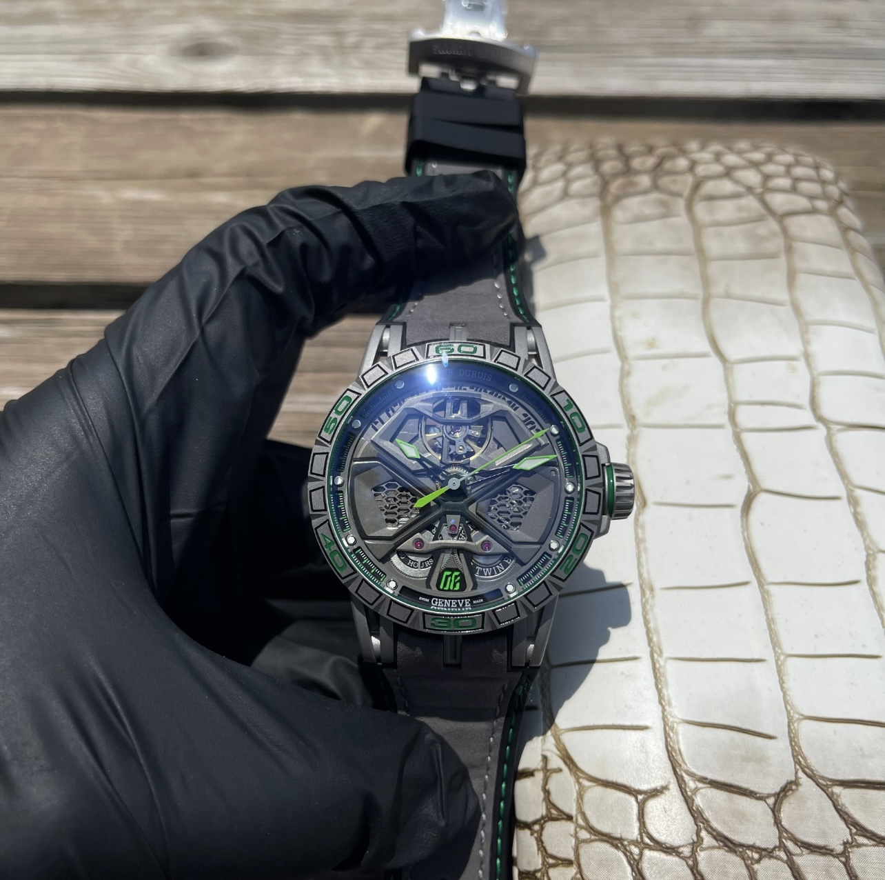 Luxury Roger Dubuis Excalibur Royal Series watch with unique design, sapphire crystal, black DLC coating, Geneva etching, and rubber strap.