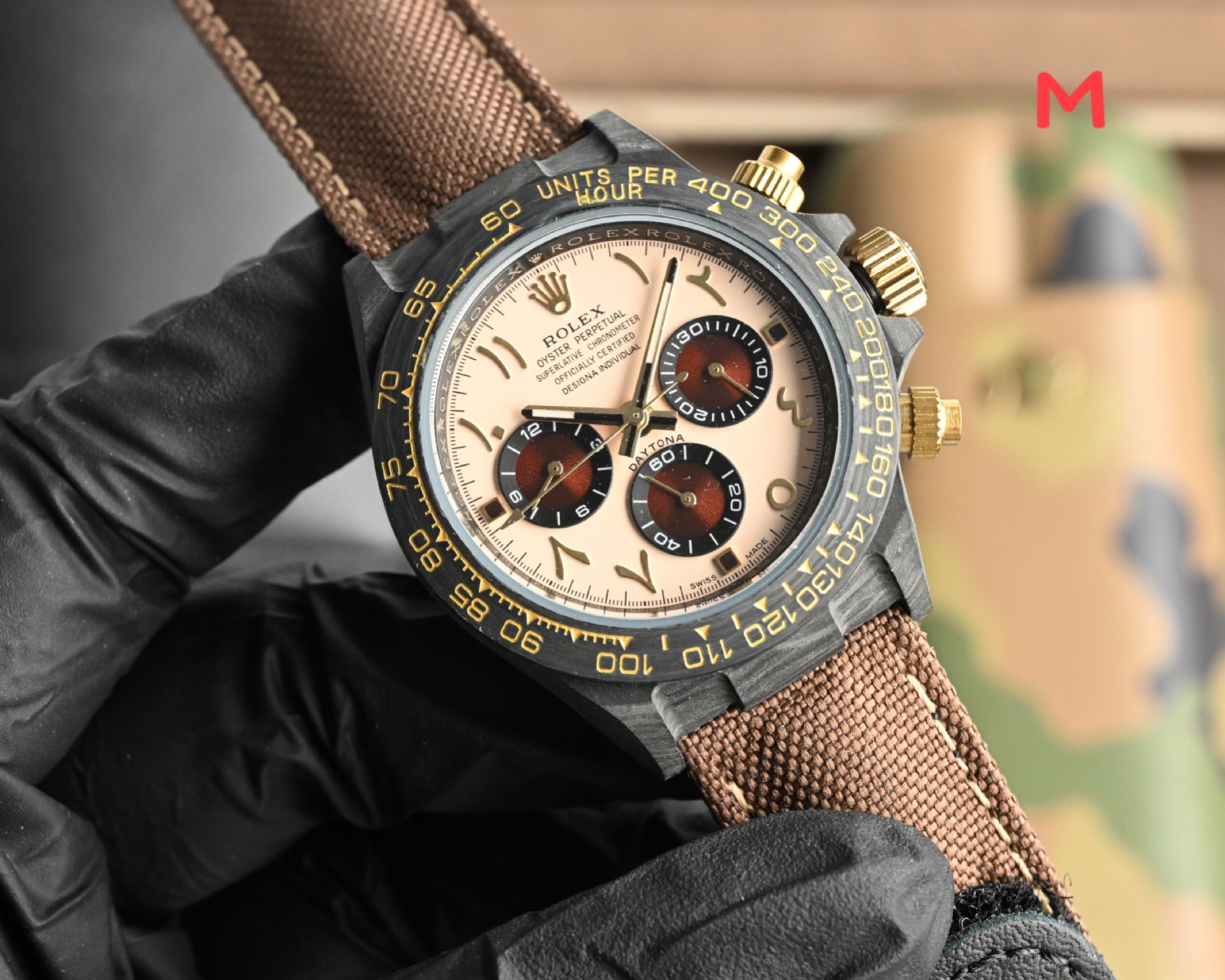 Rolex Cosmograph Daytona black bezel, champagne dial, gold accents, brown strap 40mm Men's Automatic