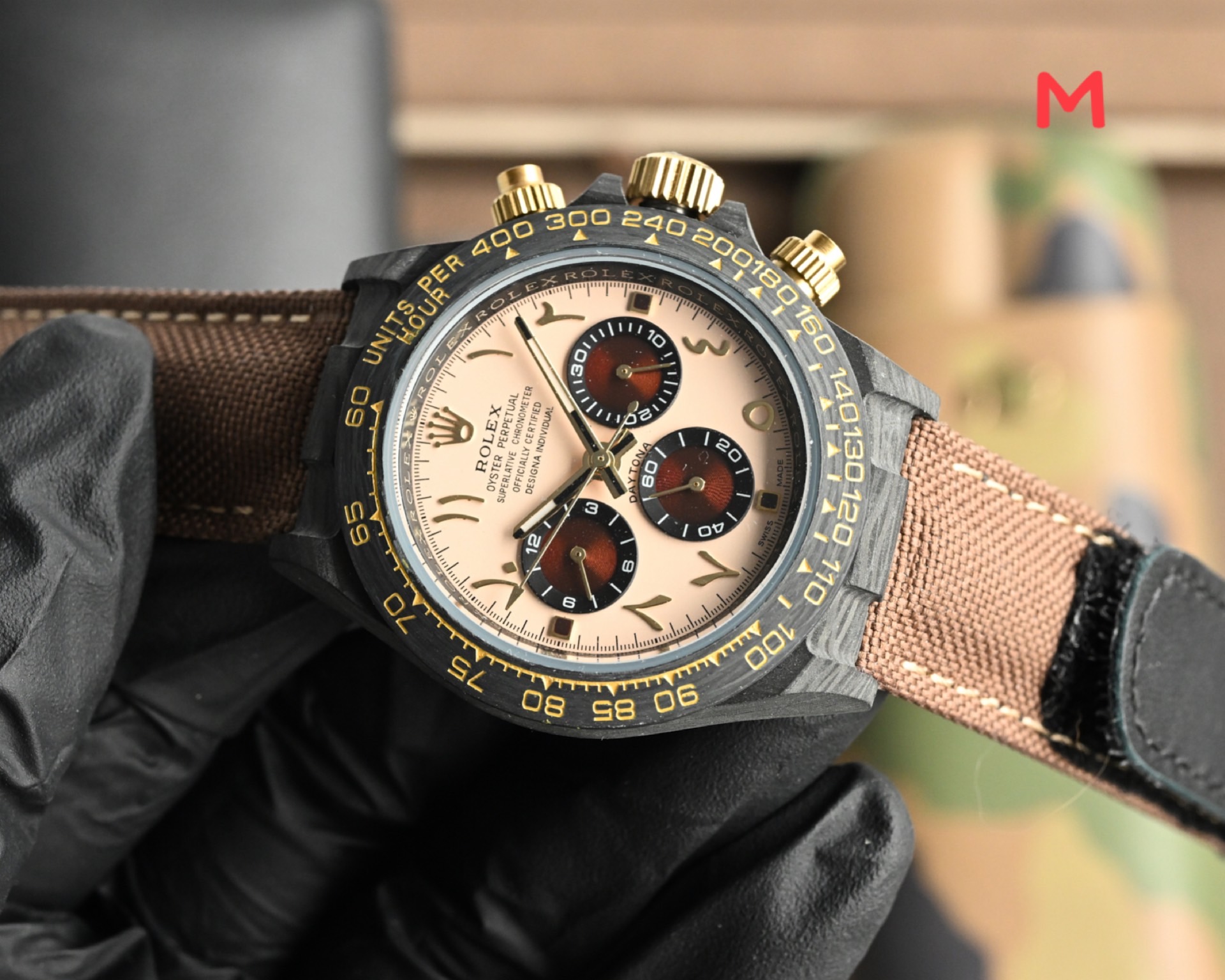 Rolex Cosmograph Daytona black bezel, champagne dial, gold accents, brown strap 40mm Men's Automatic