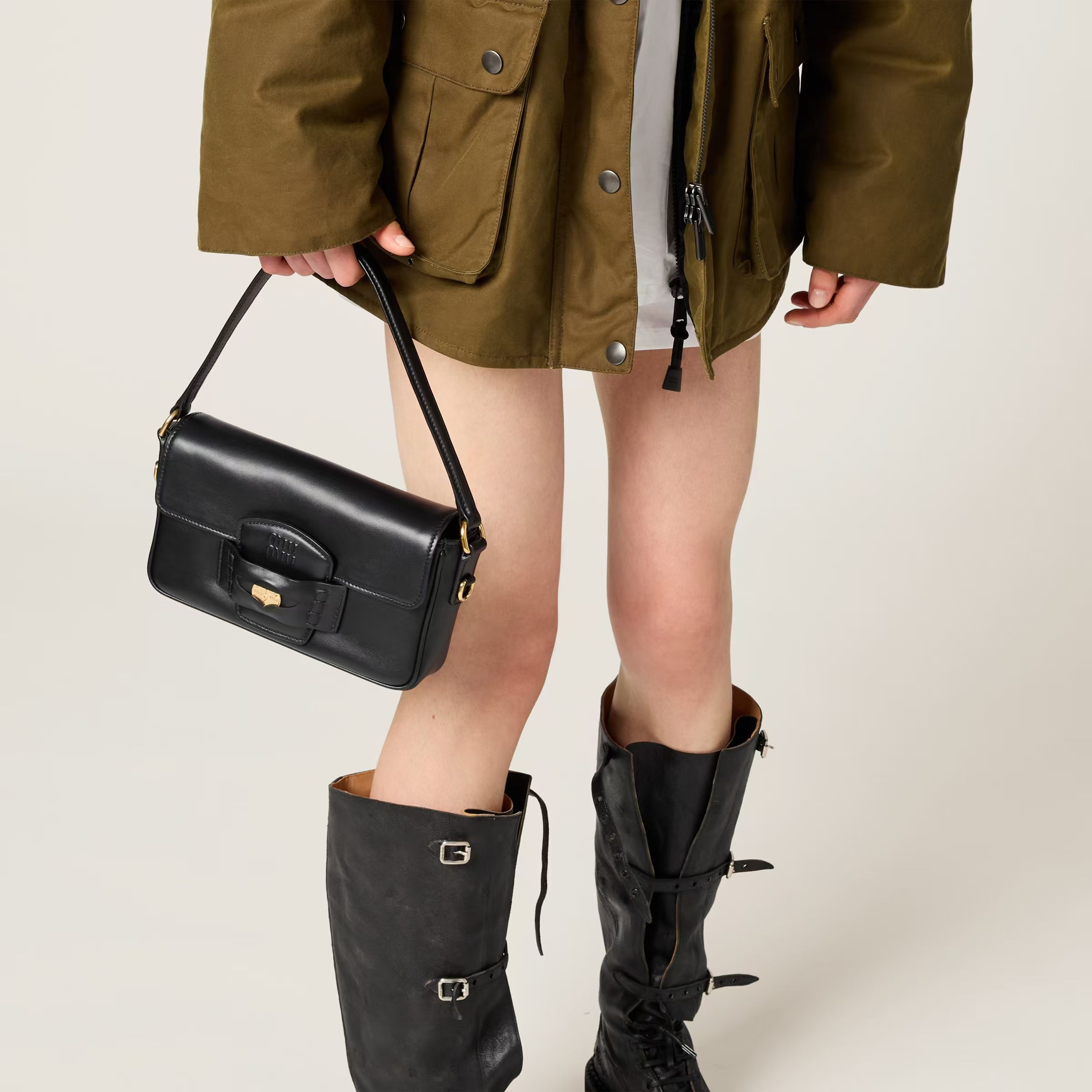 Miu Miu Wow, its a gold coin bag, bring it with you to bring your own wealth, it looks good