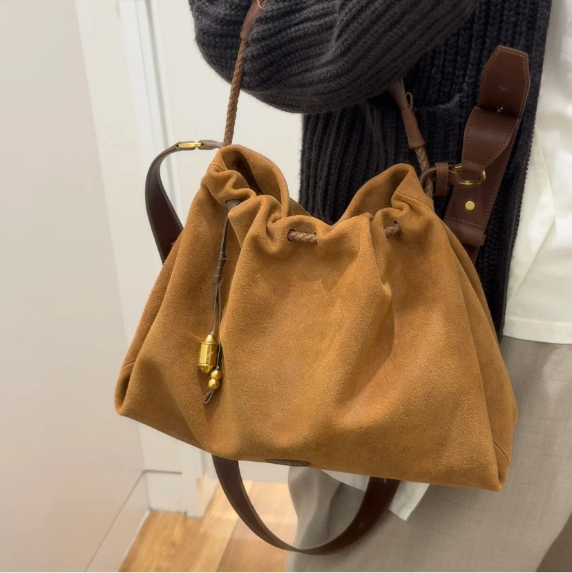 Crafted from deerskin, this hobo bag features a relaxed silhouette with - Comprehensive