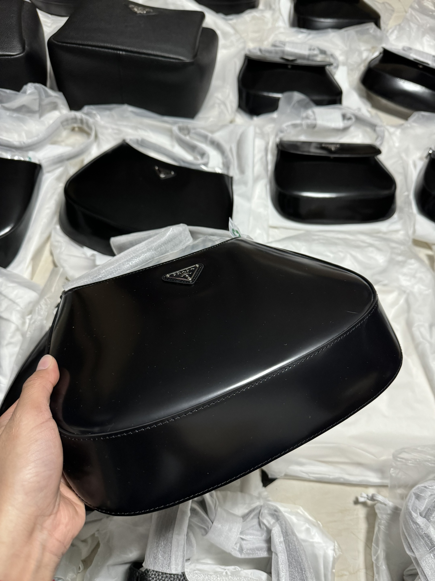 Customers order Prada at the end of the year, and take actual photos of delivery
