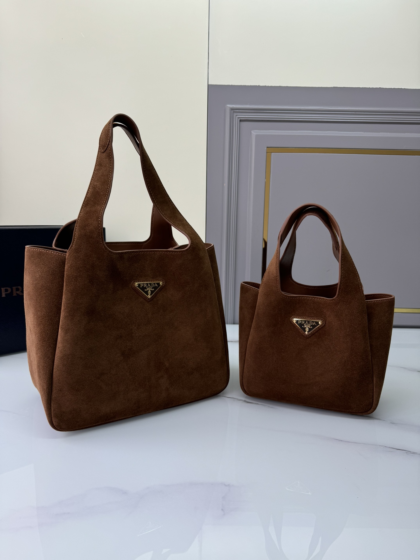 Size comparisonPrada bucket bag