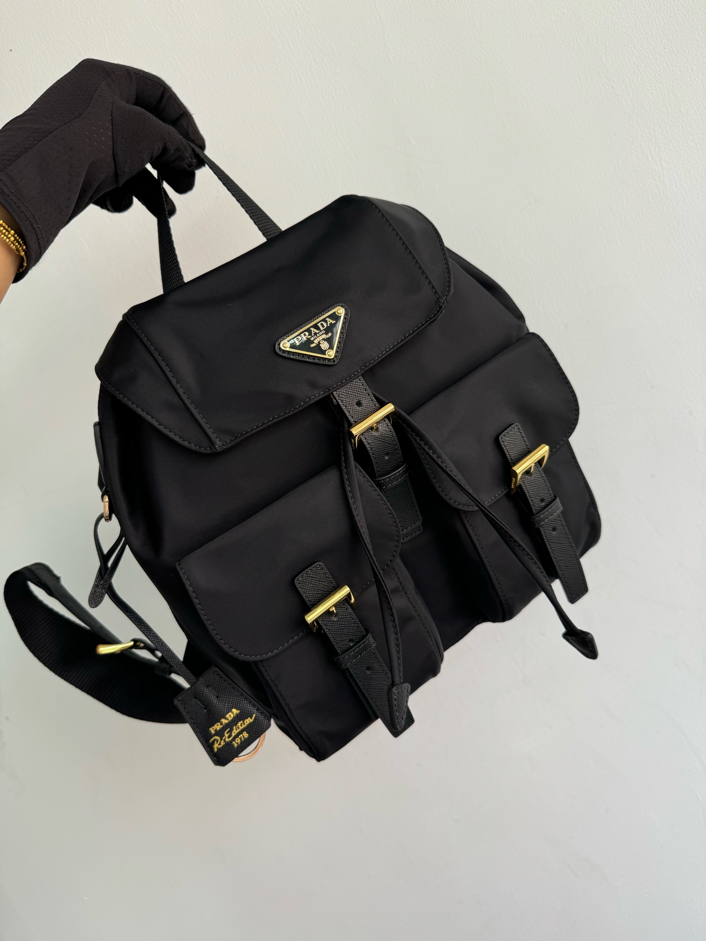 To several prada gold buckle classic backpacks