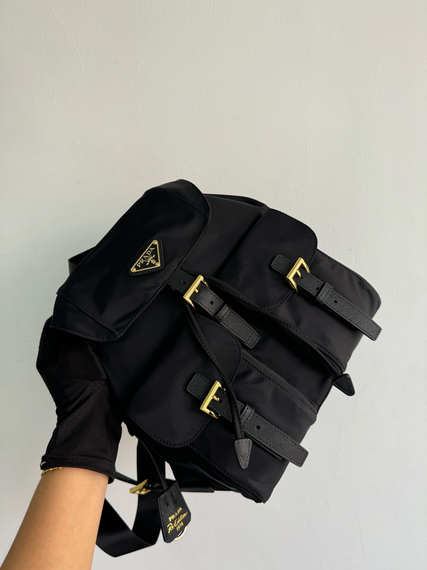 To several prada gold buckle classic backpacks