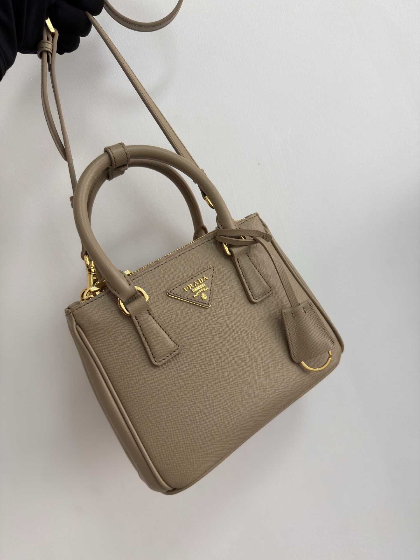 Prada mini killer bag is officially on sale as 1BA906. Pradas Galleria handbag is made of iconic Saffiano cowhide, equipped with a detachable sho