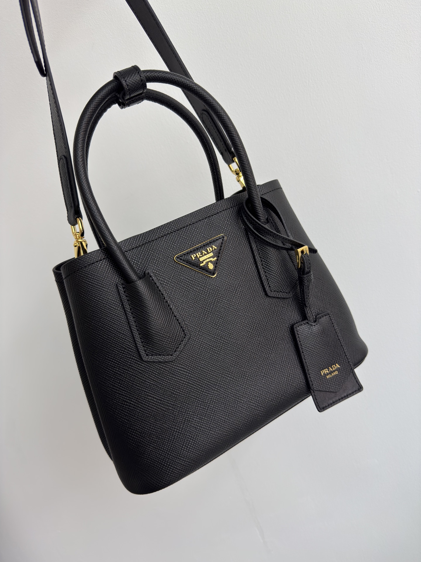 Prada's new DoubleBagmini shopping bag Double series inspired mini bag imported thick cross-grain cowhide, with full sheepskin inside. Elegant an
