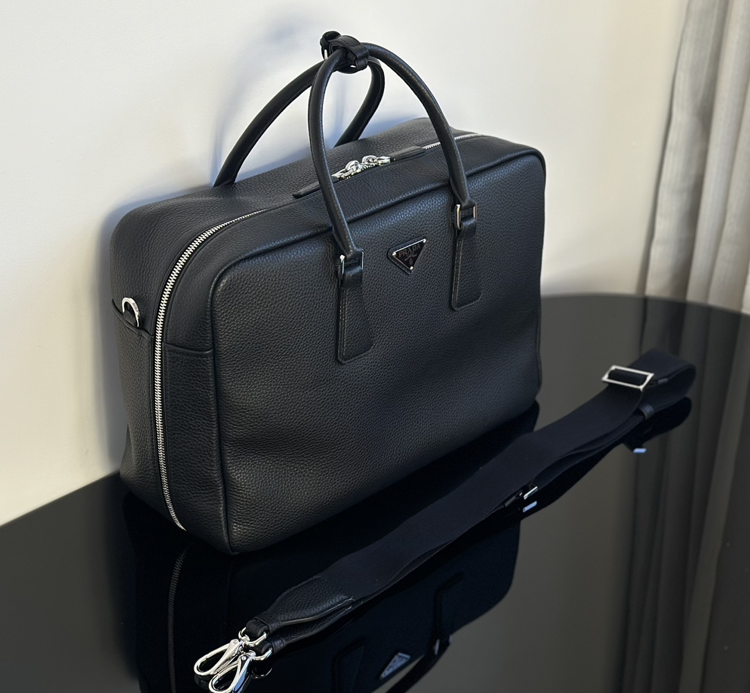 Real shots of Pradas 24 thick pebbled briefcases,