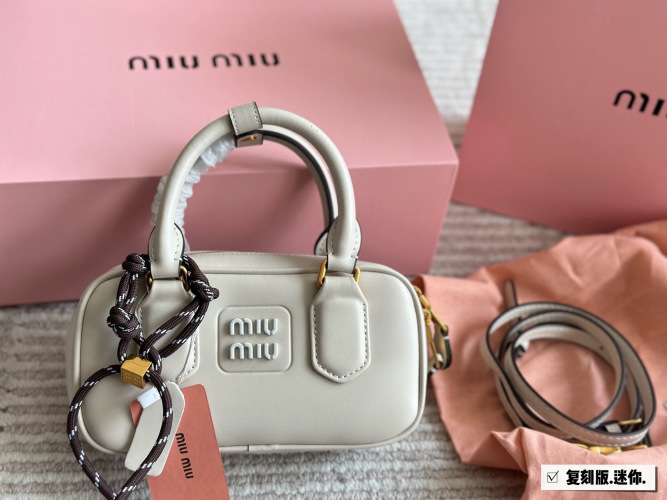 Miu Miu Bowling/Briefcase Bag - Sweet Style, Functional, and Versatile 1 Miu Miu Bowling/Briefcase Bag – Sweet Style, Functional, and Versatile