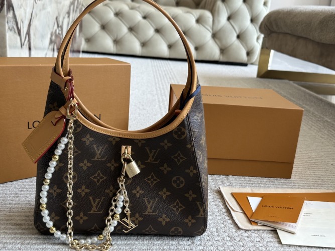 Louis Vuitton The Drop Monogram Empreinte Leather Hobo Bag with Chain 1 Louis Vuitton The Drop Monogram Empreinte Leather Hobo Bag with Chain